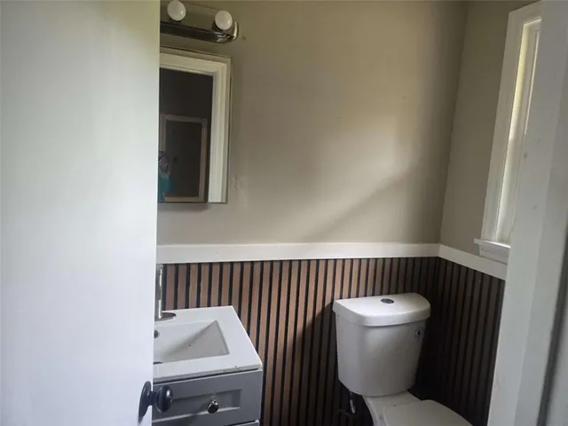 a bathroom with a toilet and a sink