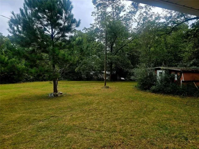 a view of a swimming pool with a bench