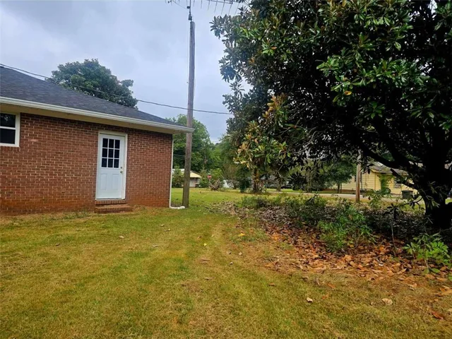 a view of a yard in front of a house