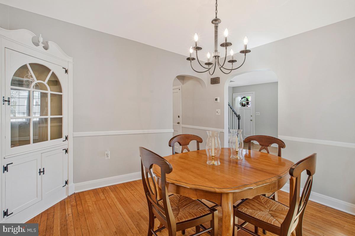 601 Forest View Road Linthicum Heights, MD 21090 - Photo 9 of 37 a view of a dining room with furniture and chandelier
