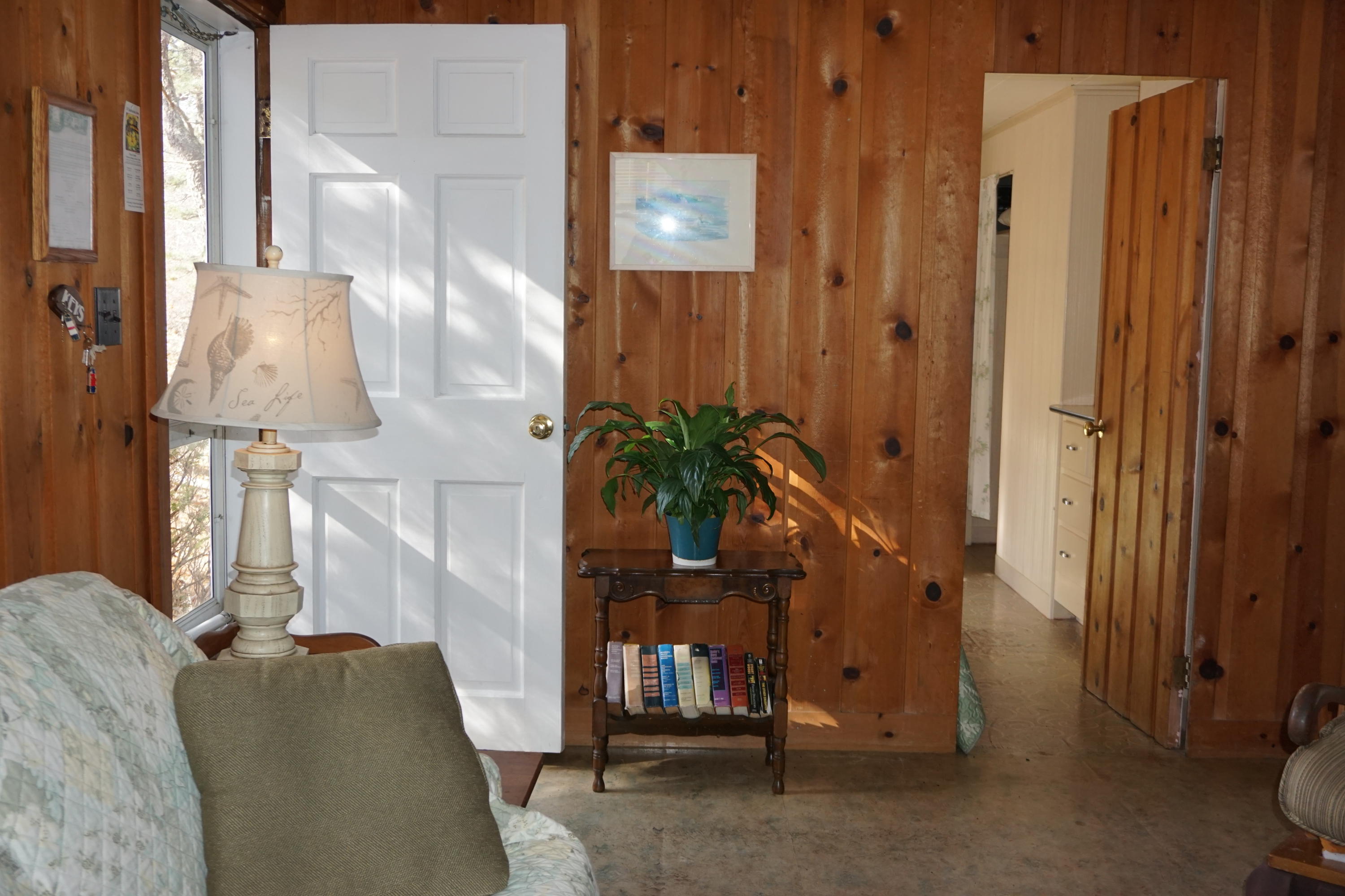 124 Castle Road, Unit 4 Truro, MA 02666 - Photo 11 of 20 a living room with furniture and a lamp