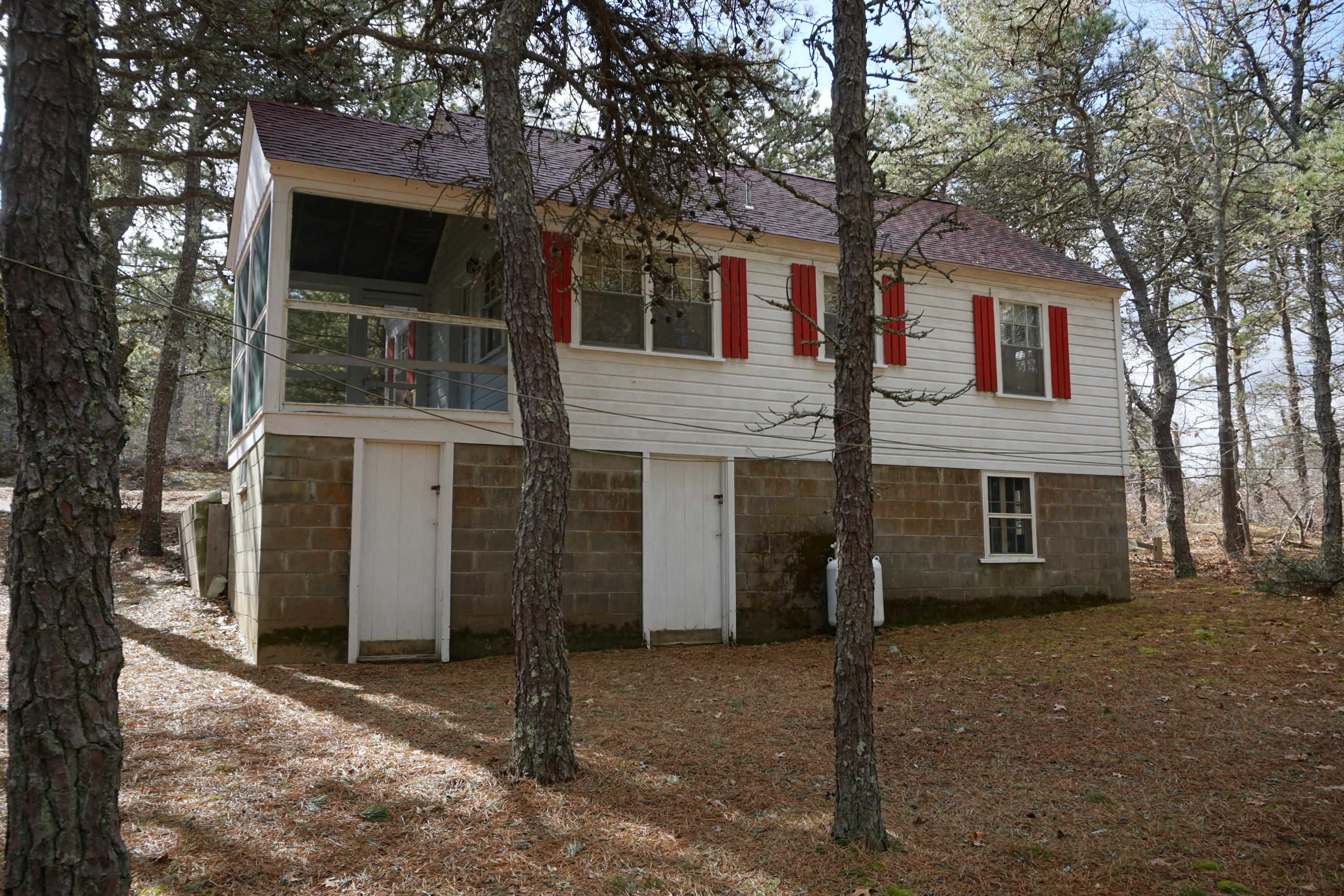 124 Castle Road, Unit 4 Truro, MA 02666 - Photo 3 of 20 a view of a house with a yard and large tree