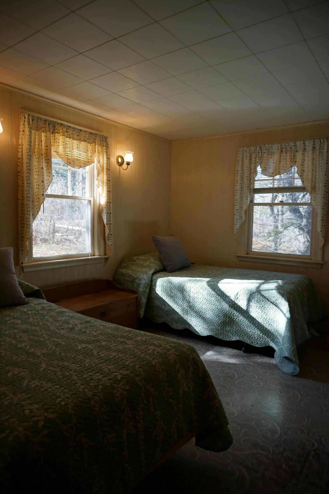 124 Castle Road, Unit 4 Truro, MA 02666 - Photo 4 of 20 a bedroom with bed and window