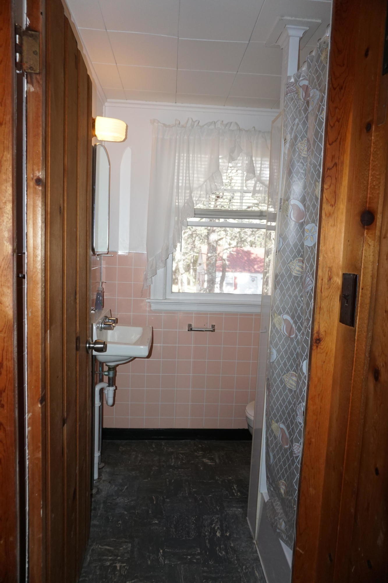 124 Castle Road, Unit 4 Truro, MA 02666 - Photo 9 of 20 a bathroom with a sink a vanity and mirror