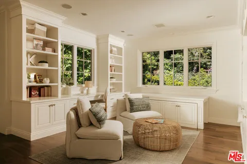 a living room with furniture and windows