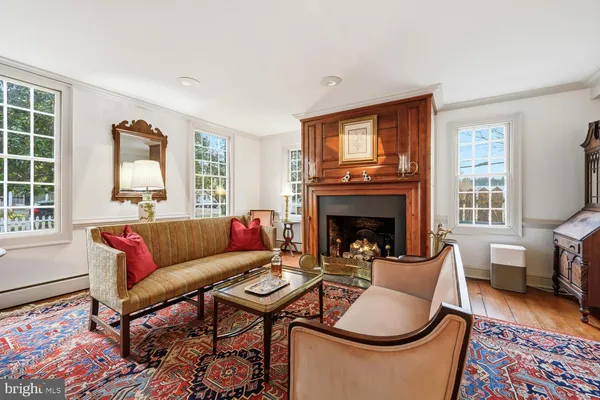 a view of a dining room with furniture and a chandelier