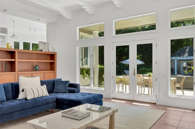 a living room with furniture and windows