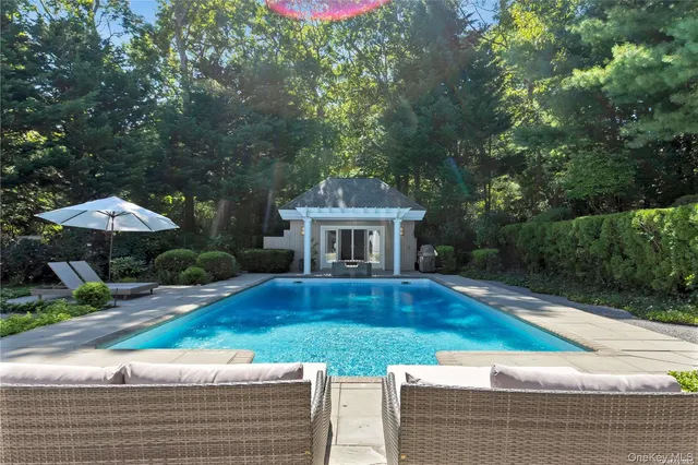 a front view of house with yard and seating area