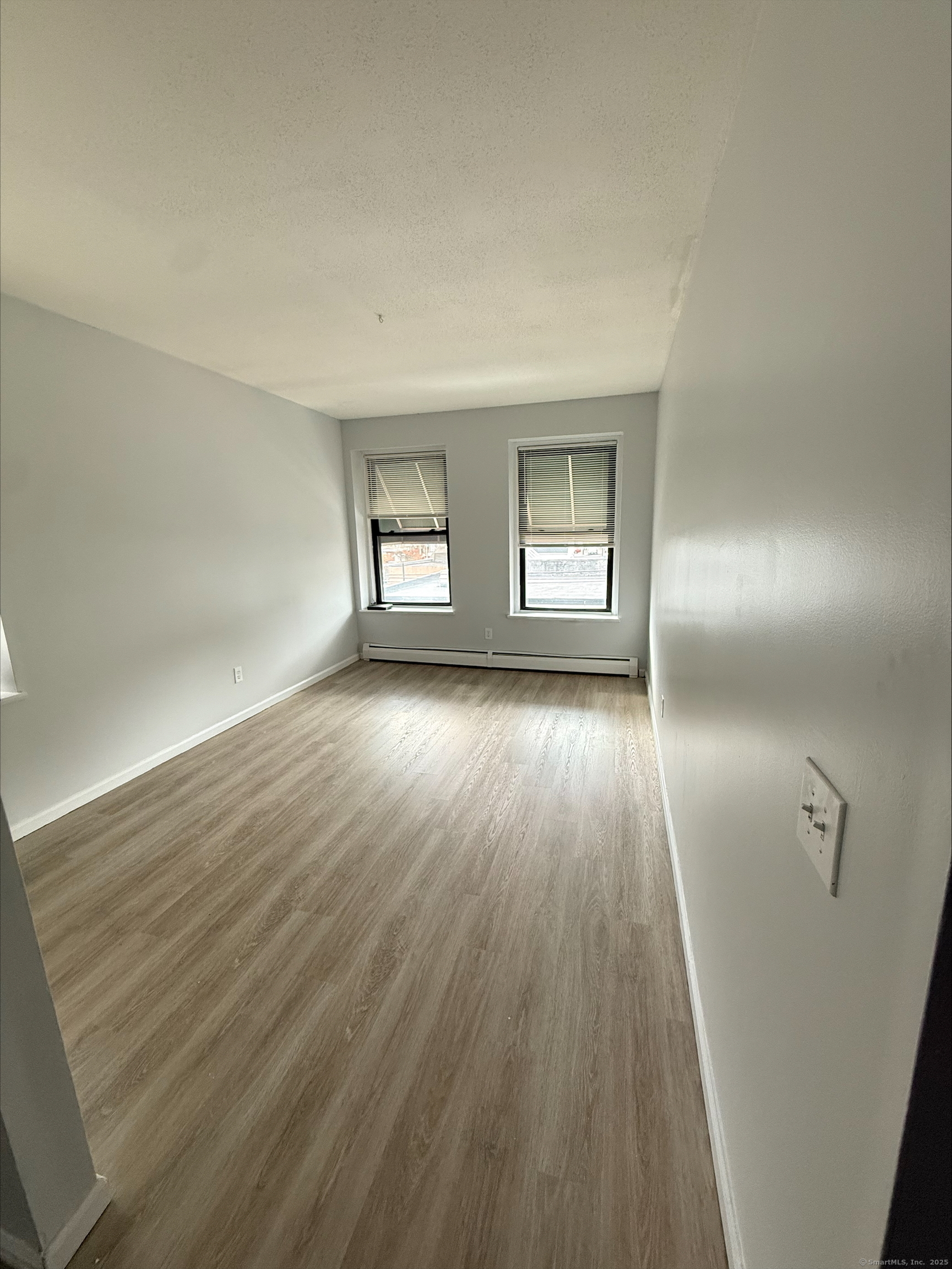 441 Howe Avenue Shelton, CT 06484 - Photo 4 of 8 wooden floor in an empty room with a window