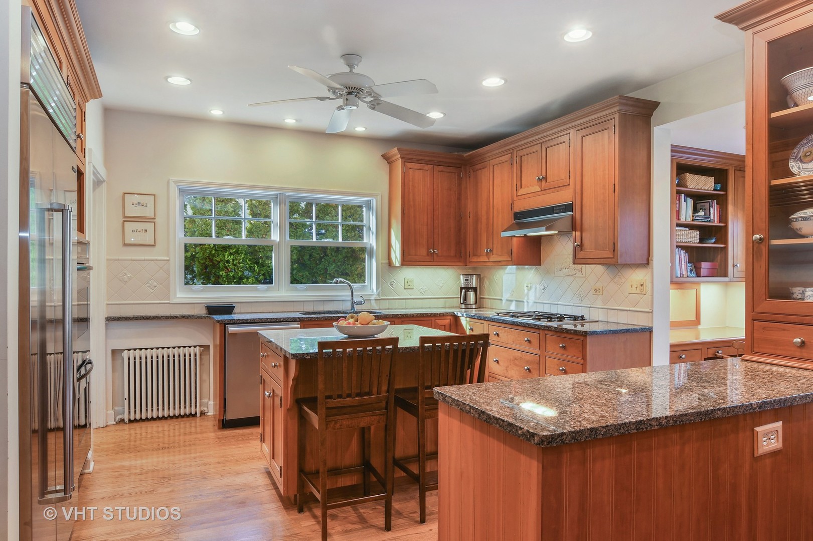 141 Robsart Place Kenilworth, IL 60043 - Photo 11 of 38 a kitchen with granite countertop a sink and a stove