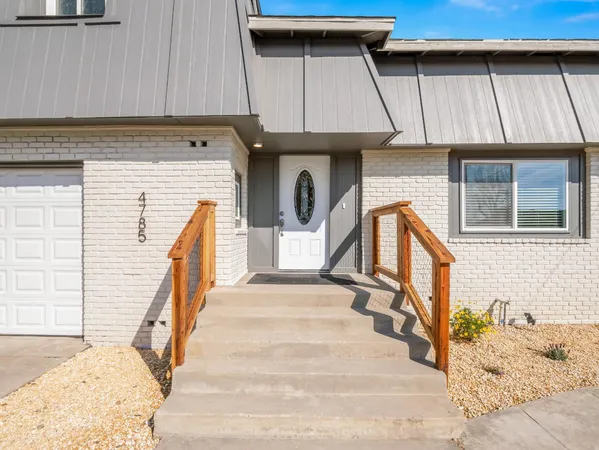 a bathroom with a sink vanity granite and a mirror