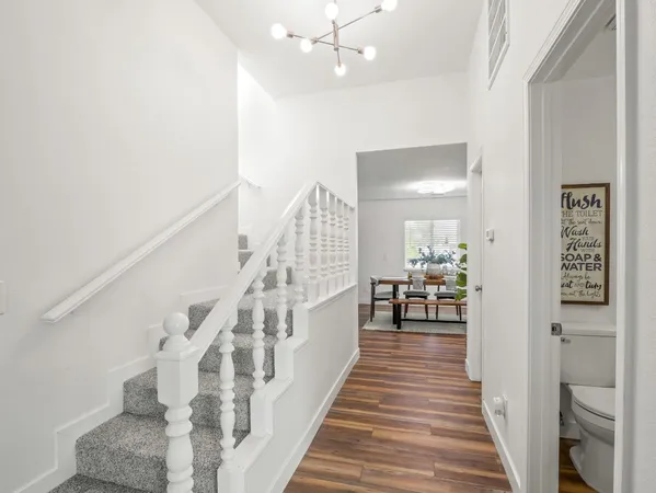 a view of a swimming pool with an outdoor seating and a yard