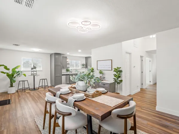 a swimming pool view with a outdoor seating