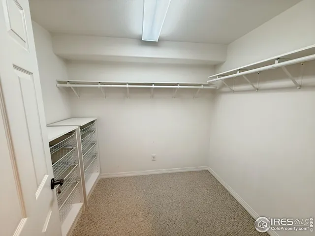 a bathroom with a sink a toilet a mirror and shower