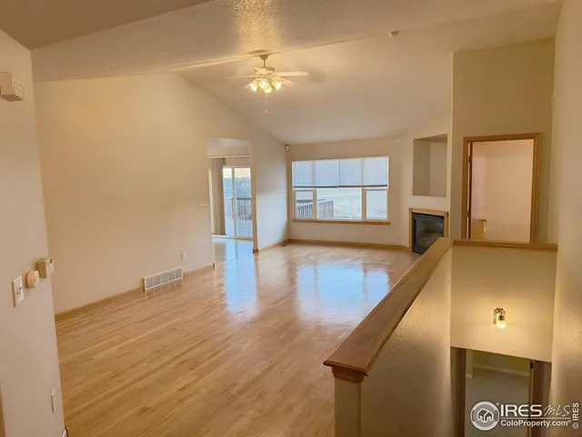 a view of a living room with hardwood floor