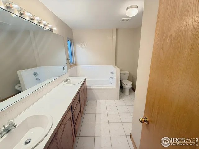 a bathroom with a bathtub toilet and sink