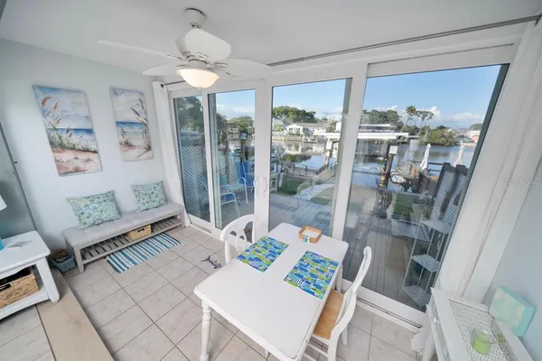 a view of a dining room with furniture wooden floor and next to a window