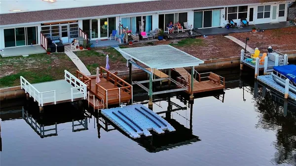 a terrace with outdoor seating and city view