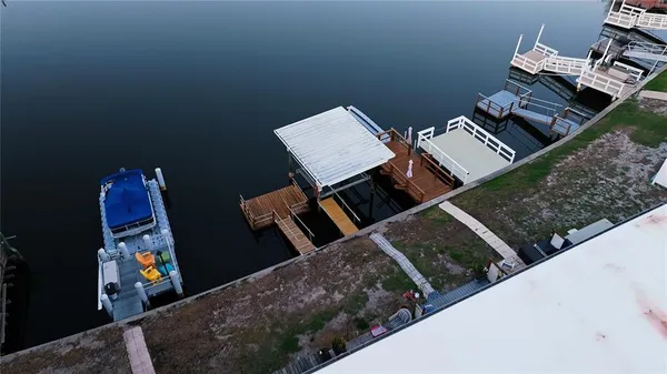 an aerial view of a house with parking space