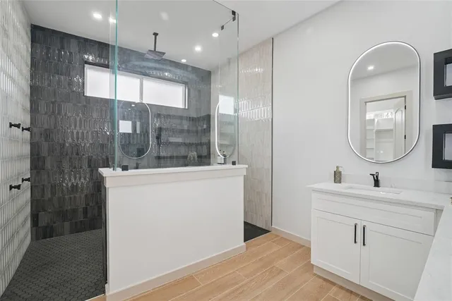 a bathroom with a double vanity sink and a mirror
