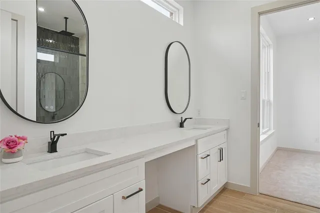 a bathroom with a shower and a sink