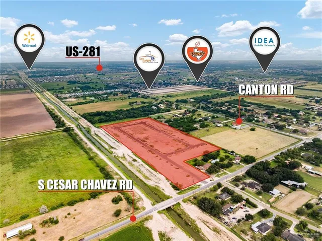 a front view of a residential apartment building with a yard