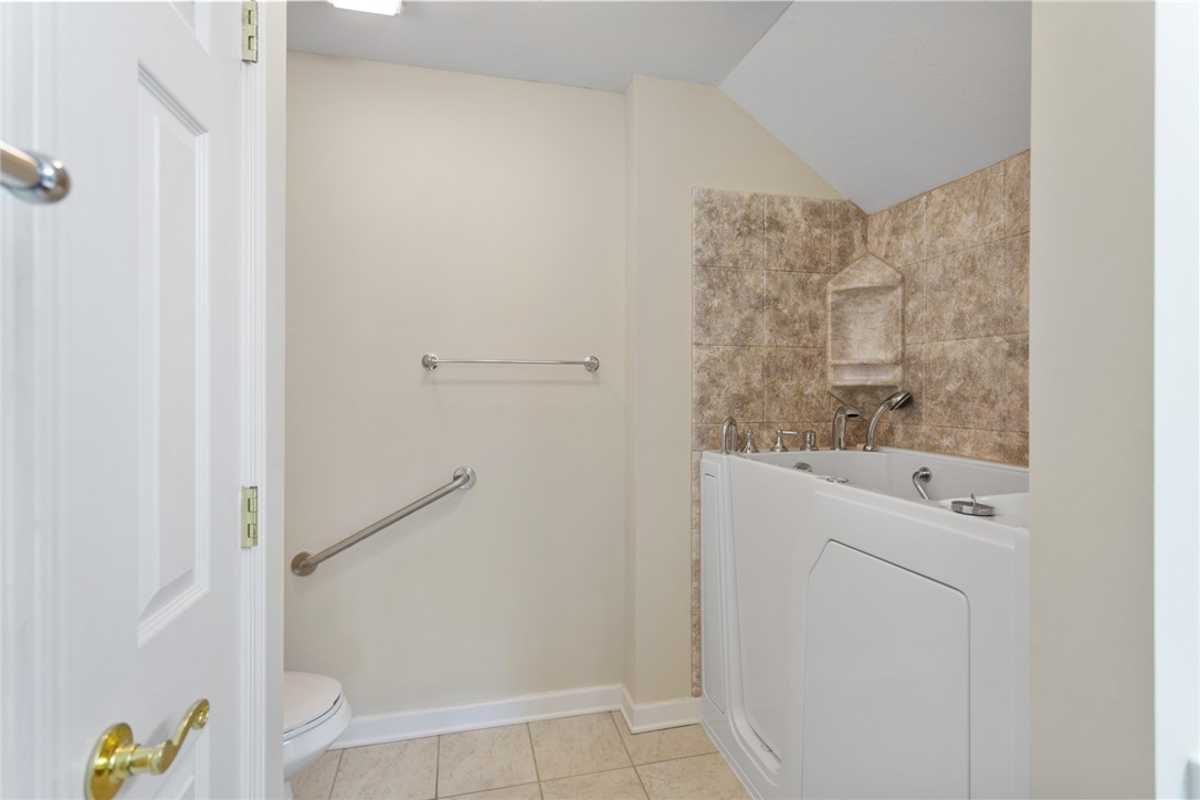 155 Life Style Lane Anderson, SC 29621 - Photo 30 of 49 This bright bathroom offers a relaxing walk-in tub, with grab bar, and tiled floor.