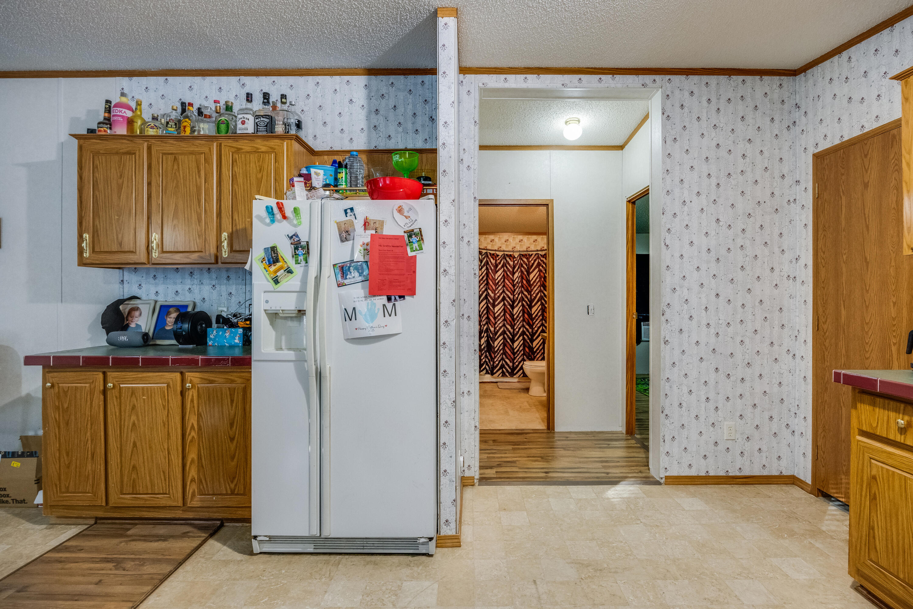 1953 Cotton Creek Road Baker, FL 32531 - Photo 14 of 38 a utility room with fridge and closet