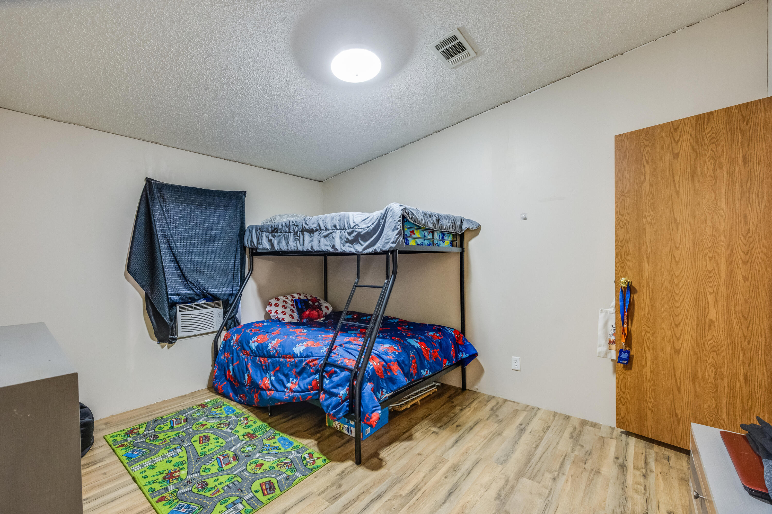 1953 Cotton Creek Road Baker, FL 32531 - Photo 21 of 38 a bedroom with a bed and a small table