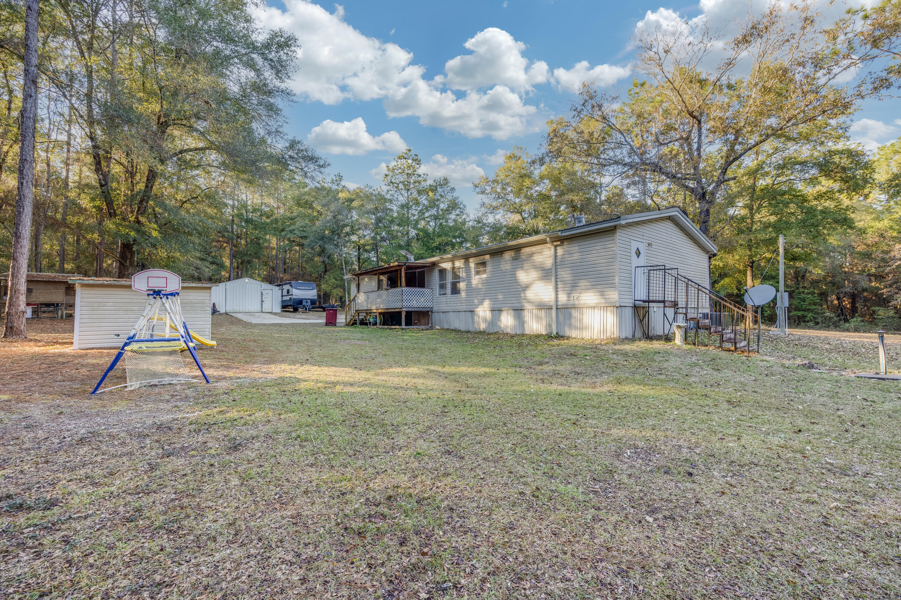 1953 Cotton Creek Road Baker, FL 32531 - Photo 28 of 38 a house view with a garden space