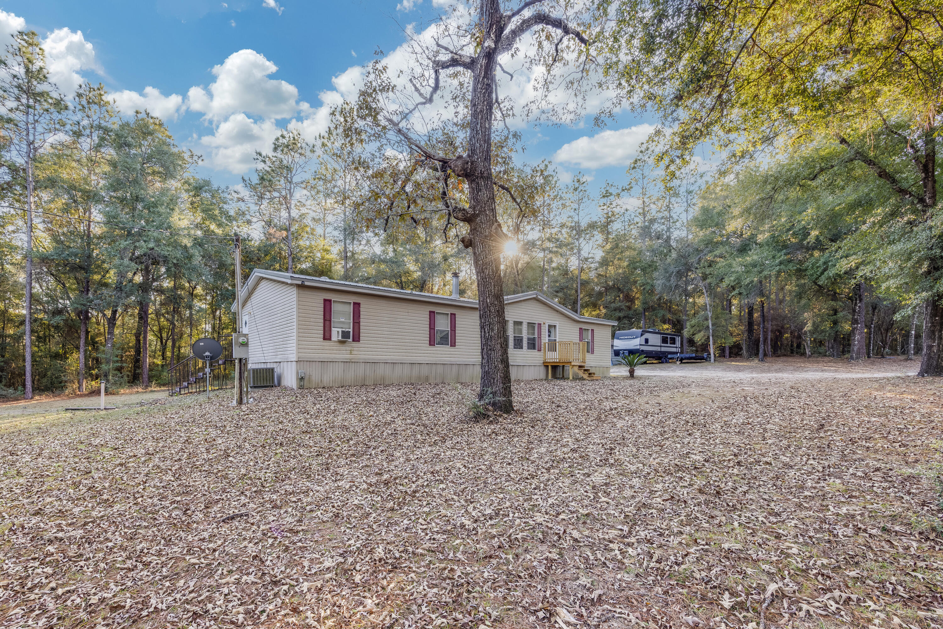1953 Cotton Creek Road Baker, FL 32531 - Photo 3 of 38 a house view with a backyard space
