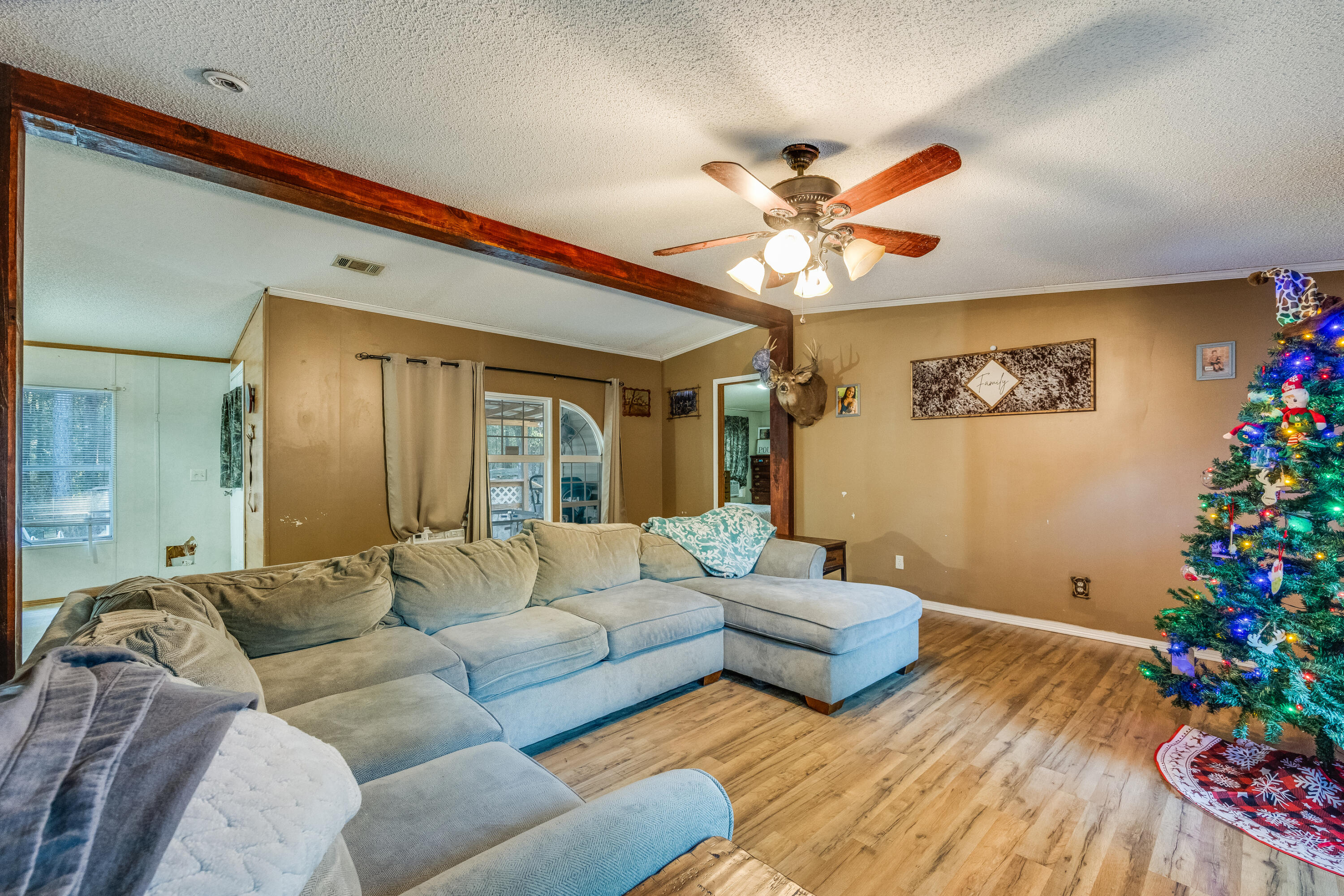 1953 Cotton Creek Road Baker, FL 32531 - Photo 6 of 38 a living room with furniture flowers and a potted plant