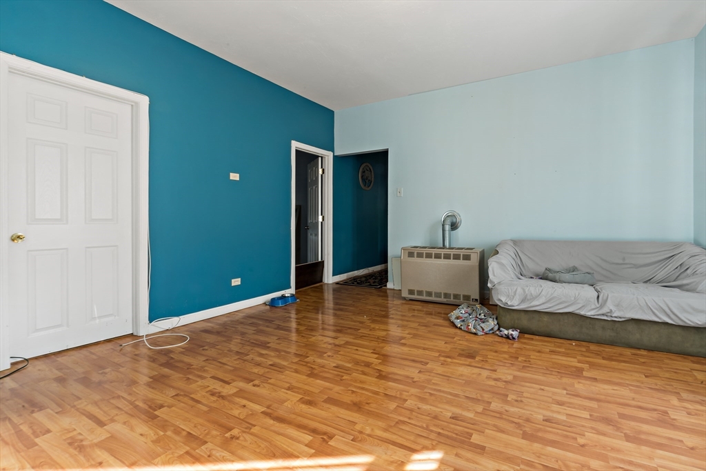 163 Warren Street Fall River, MA 02721 - Photo 28 of 39 a bedroom with a bed and a window