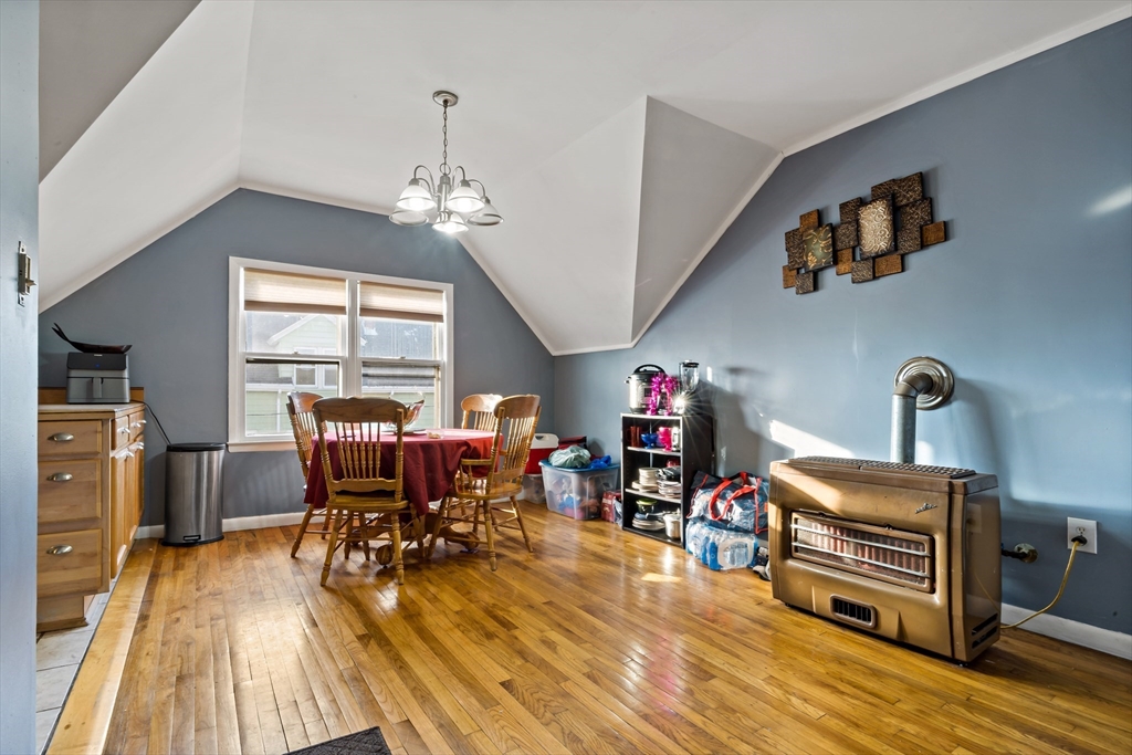 163 Warren Street Fall River, MA 02721 - Photo 39 of 39 a view of a dining room with furniture a chandelier and wooden floor