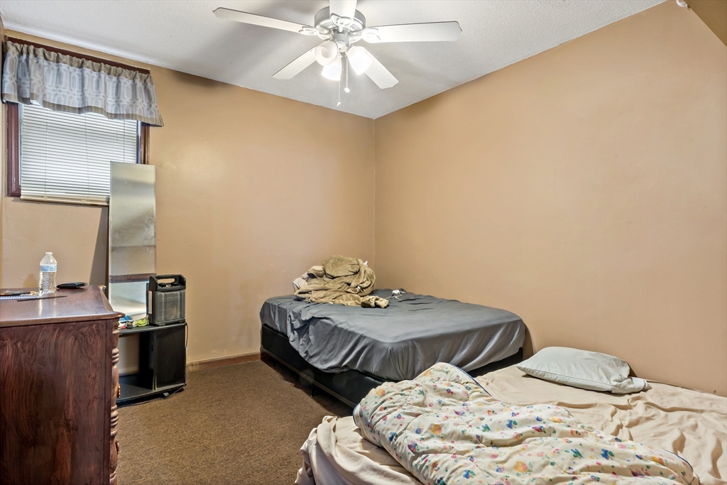 163 Warren Street Fall River, MA 02721 - Photo 5 of 39 a bedroom with bed and window
