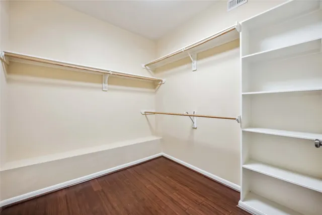 a view of an empty walk in closet