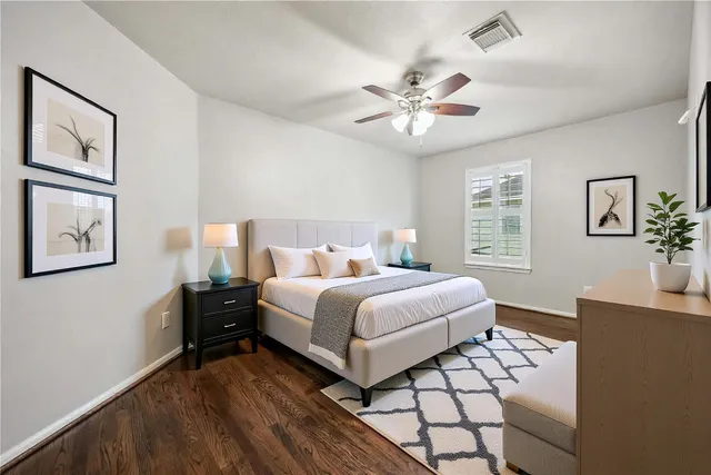 a bedroom with a large bed and a window