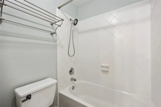 a bathroom with a shower and a toilet
