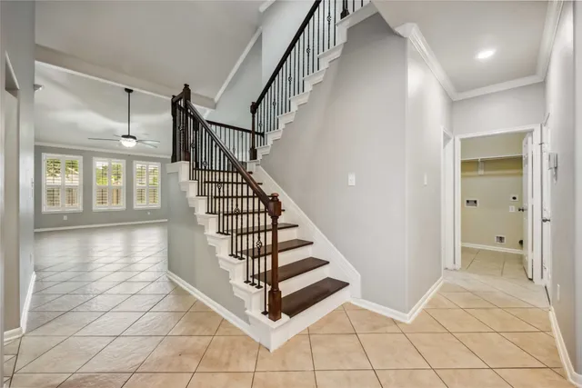 a view of entryway and hall with a front door