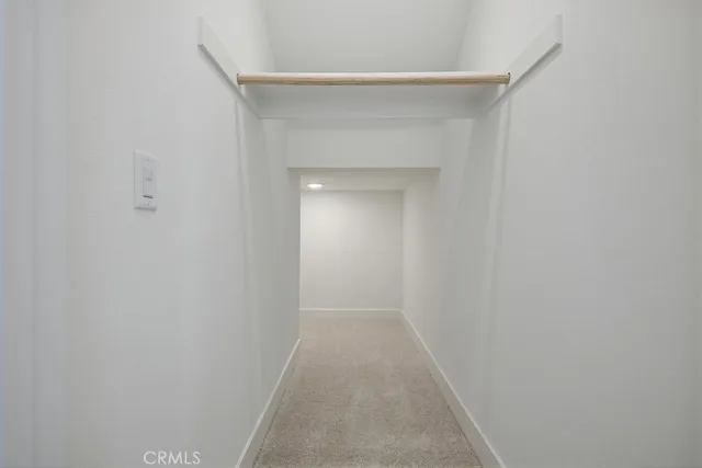 a view of kitchen with stainless steel appliances refrigerator oven and cabinets
