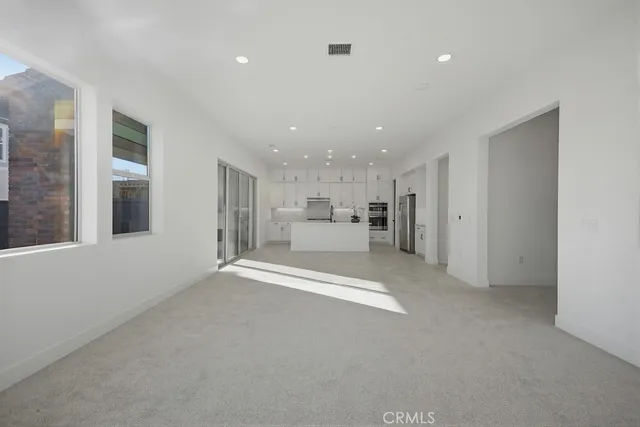a kitchen with stainless steel appliances granite countertop a sink and cabinets