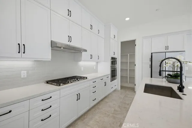 a spacious bathroom with a double vanity sink mirror and shower