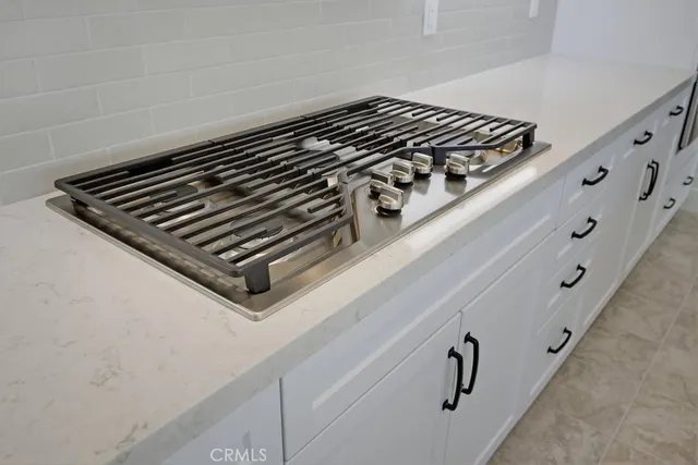 a spacious bathroom with a double vanity sink mirror and bathtub