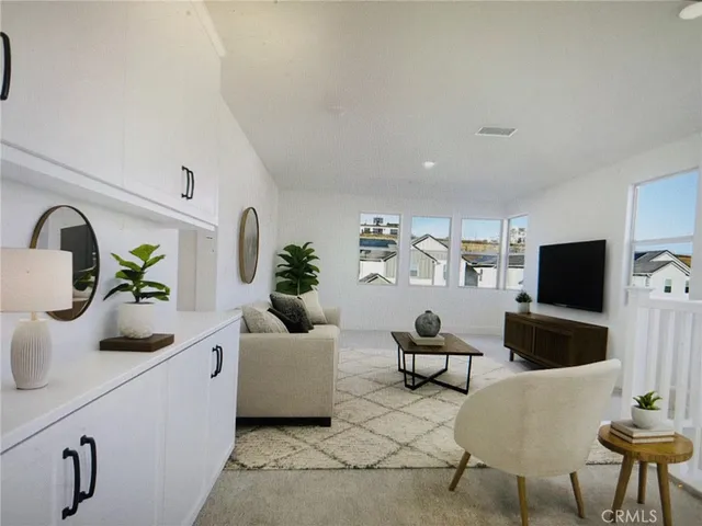 a view of staircase with railing and white walls