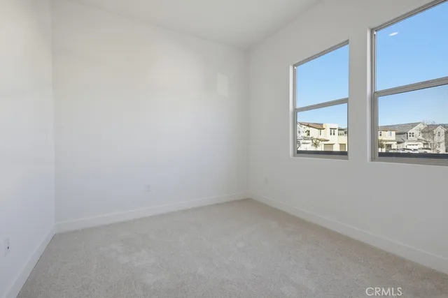a view of staircase with white walls