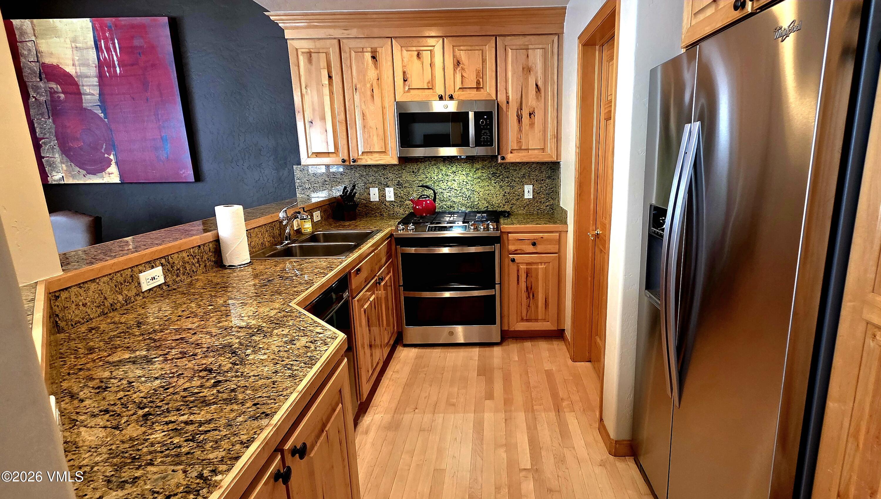 1890 Lions Ridge Loop, Unit 11 Vail, CO 81657 - Photo 3 of 46 Kitchen new floor finish