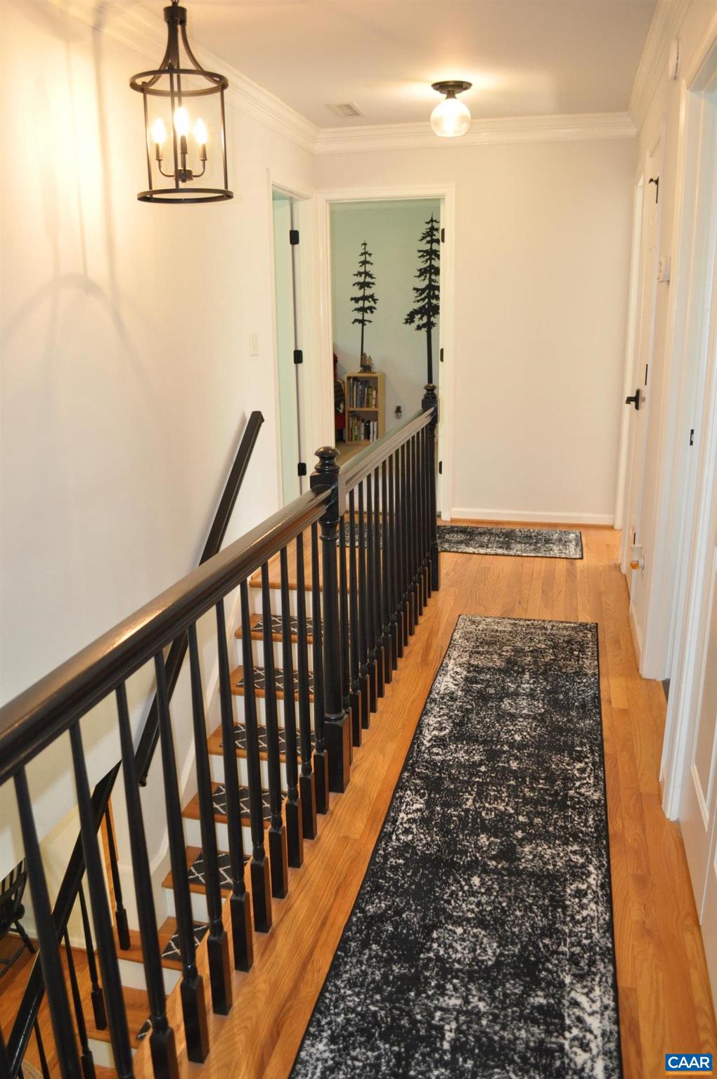 3257 Martin Kings Road Charlottesville, VA 22902 - Photo 34 of 49 a view of a hallway with wooden floor and staircase