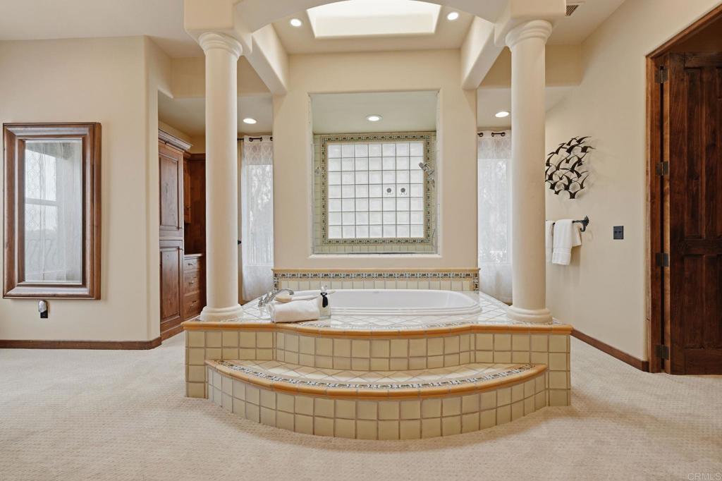 3244 Olivenhain Farms Road Encinitas, CA 92024 - Photo 30 of 47 a bathroom with tub and window