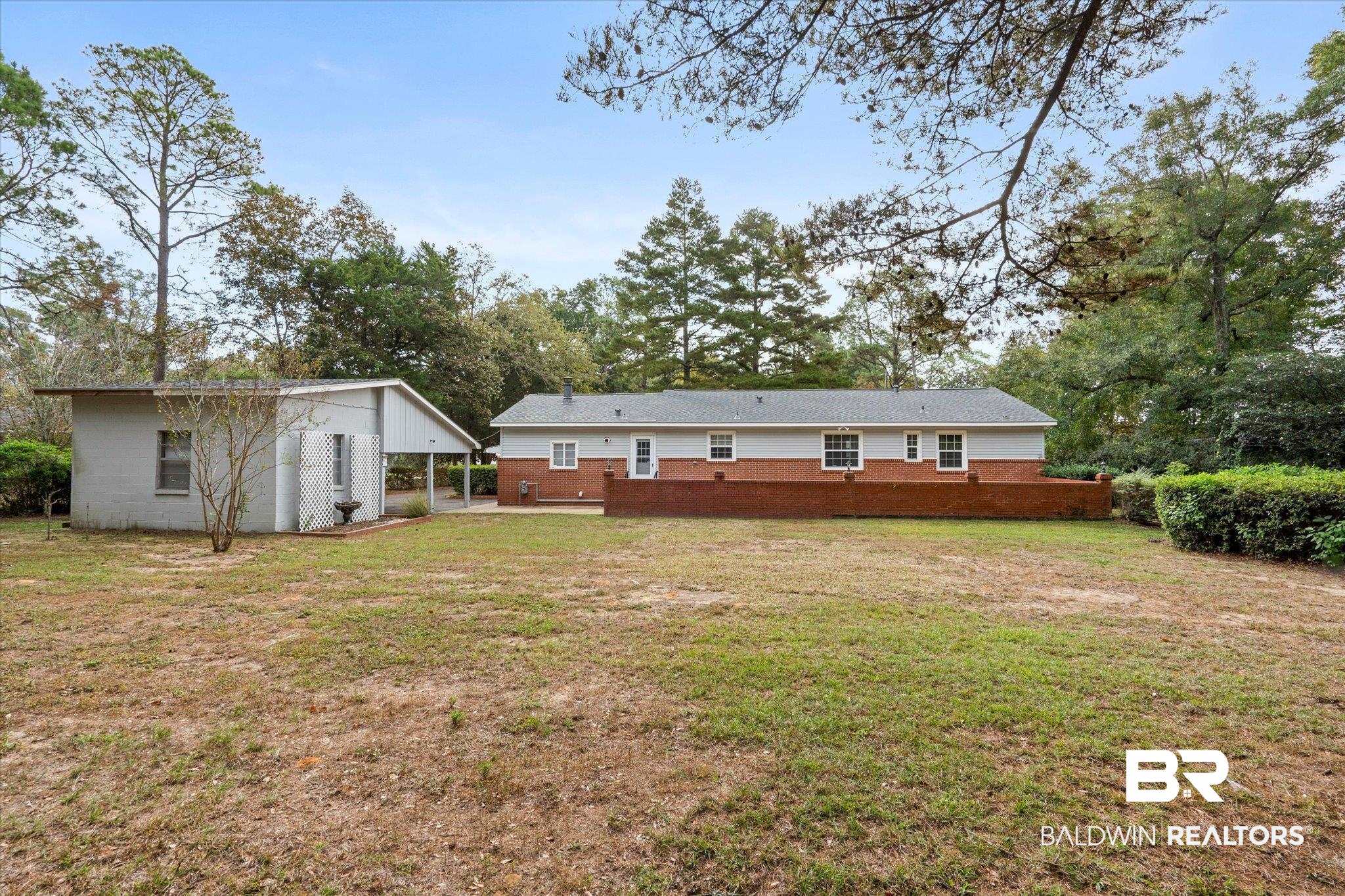 162 Bit And Spur Terrace Mobile, AL 36608 - Photo 25 of 29 Rear view of property with a yard