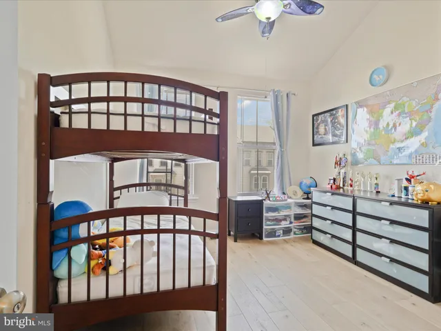 a bedroom with furniture and a window
